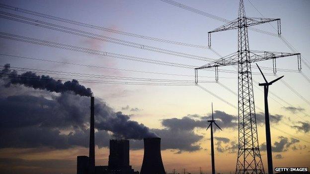 Steam rises from cooling towers at the coal-fired Kraftwerk Mehrum power plant at Haemelerwald