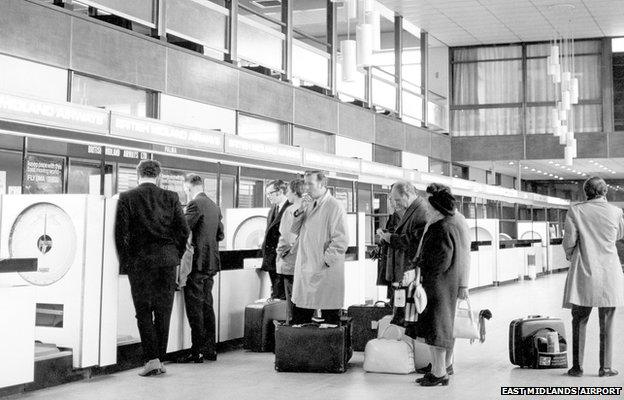 Passengers check in at the British Midlands Airways check-in desks in the late 1970s