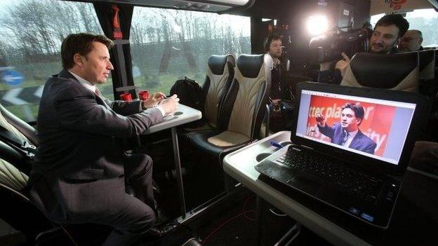 Senior Political correspondent for Sky News Jason Farrell (left) does a piece to camera on board the Labour election bus in Greater Manchester