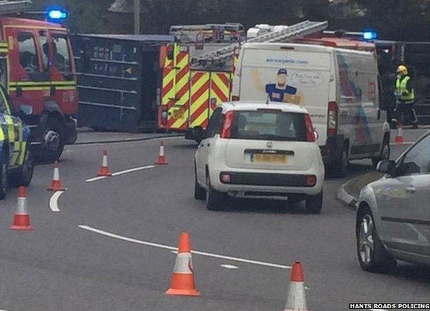 Traffic queues at site of overturned truck