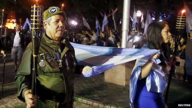 Veterans of the 1982 Falklands War march as they pay tribute to Argentine servicemen who died in the South Atlantic conflict between Britain and Argentina on the 33rd anniversary of the war over the island chain in Buenos Aires