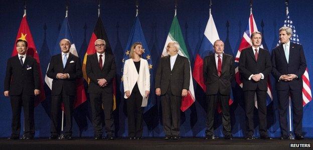 (L-R) Chinese Ambassador to the United Nations Wu Hailong, French Foreign Minister Laurent Fabius, German Foreign Minister Frank Walter Steinmeier, European Union High Representative for Foreign Affairs and Security Policy Federica Mogherini, Iranian Foreign Minister Javad Zarifat, Russian Deputy Political Director Alexey Karpov, British Foreign Secretary Philip Hammond and U.S. Secretary of State John Kerry