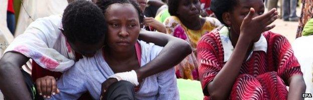 Some of the Garissa University students who were rescued, comfort each other at the Garissa military camp, in Garissa town