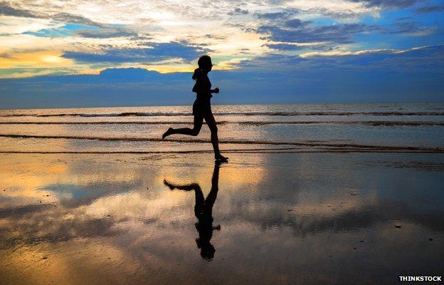 Woman running on a beach
