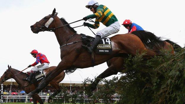 AP McCoy jumps the last fence in them 2014 Grand National