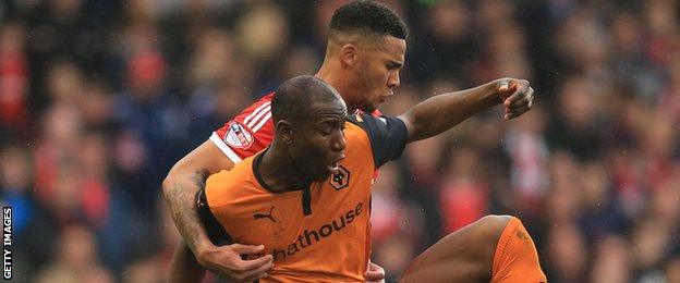 Nottingham Forest's Jamaal Lascelles and Wolves' Benik Afobe