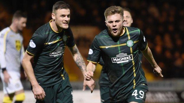 James Forrest (right) celebrates giving Celtic the lead