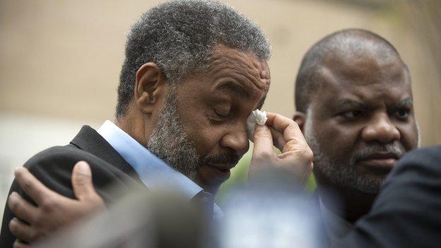 Anthony Ray Hinton wipes tears from his eyes after being released