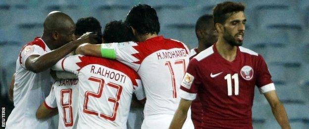 Bahrain celebrate scoring against Qatar at the Asian Cup