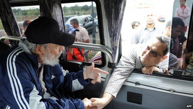 Official handout picture of Fidel Castro greeting a member of the Venezuelan delegation II flight Solidarity Bolivar-Marti who are in Cuba taking part in social and political activities, in Havana on March 30, 2015.