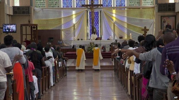 Kenyan Christians pray as they join a morning service at Holy Family Basilica in Nairobi, Kenya on 5 April 2015