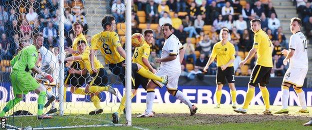 Alloa striker Michael Chopra (centre) watches on as his effort hits the post