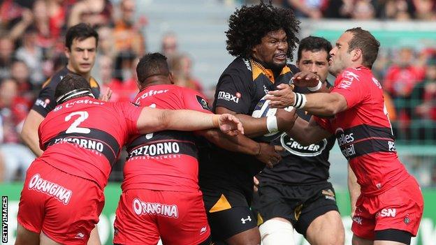 Wasps flanker Ashley Johnson takes on three Toulon defenders