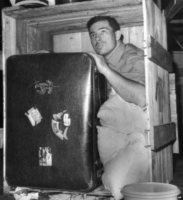 Pan American cargo handler Gary Hatch posing inside Brian Robson's crate