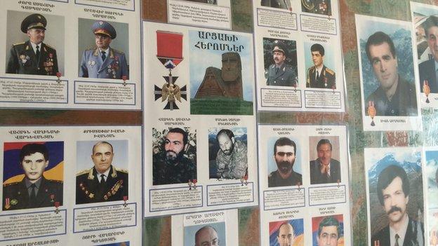 School poster showing Armenian veterans and heroes of the Karabakh war