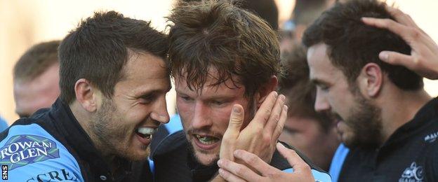 Peter Horne is congratulated by Tommy Seymour and Alex Dunbar after scoring for Glasgow Warriors