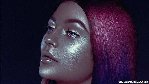 The picture of Kylie Jenner appearing darker than usual with metallic looking skin and pink hair