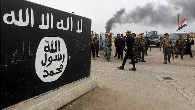 An Islamic State mural outside Tikrit