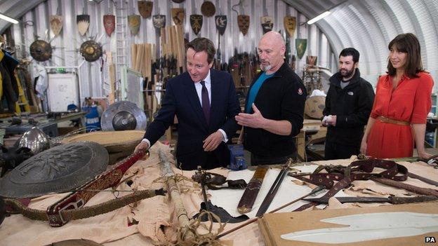 David Cameron and his wife Samantha were shown props and backdrops from the Game of Thrones TV series during their visit to Belfast