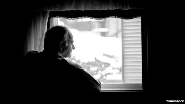 Man looking out the window