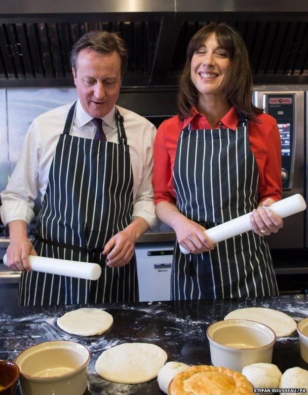 Prime Minister David Cameron and his wife Samantha help to make Steak, Ale and Stilton pies at Brains Brewery in Cardiff