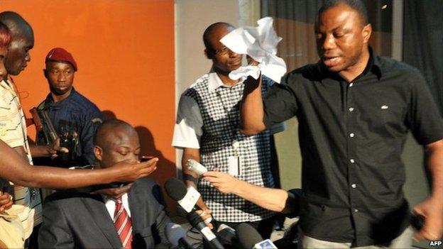 Ivory Coast's Damana Adia Pickass grabs the election results and tears them up - December 2010