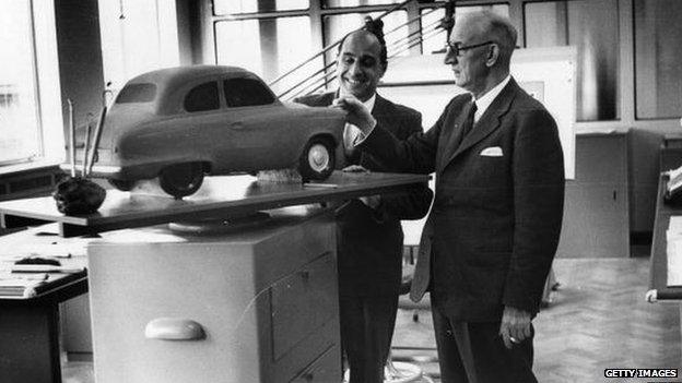 Austin Chairman L P Lord (right) and stylist R Burzi inspect the model of the latest Austin Seven