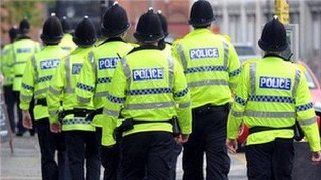 Police officers in high-visibility coats