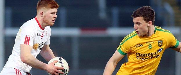 Tyrone's Cathal McShane takes on Donegal opponent Tony McClenaghan in the Celtic Park final