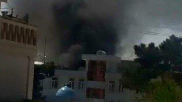 Smoke billows from the Balkh province court complex following an attack by gunmen