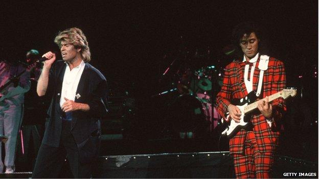 George Michael (left) and Andrew Ridgeley, of the pop group Wham playing a concert at Beijing's People's Stadium on 7 April 1985.