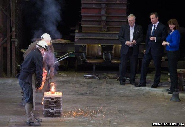 Prime Minister David Cameron is shown around the John Taylor Bell Foundry in Loughborough, the largest bell foundry in the world, with local candidate and Education secretary Nicky Morgan where they watched a bell being cast