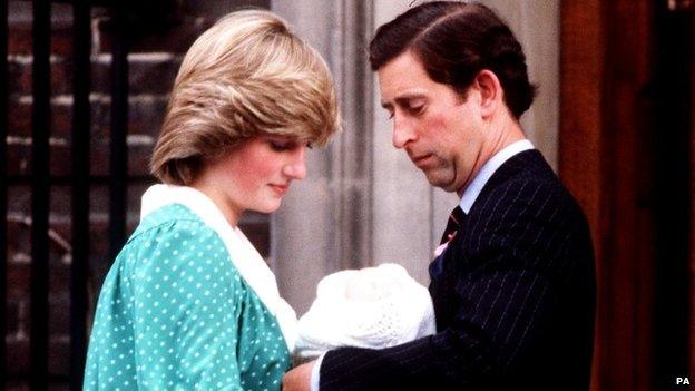 Prince of Wales handing Prince William to the Princess of Wales outside the Lindo Wing of St. Mary's Hospital