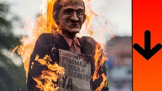 A dummy of US President Barack Obama reading "Obama abolish the decree now" is burnt as the "Burning of Judas", during an Easter celebration, at El Valle shantytown in Caracas 5 April 2015