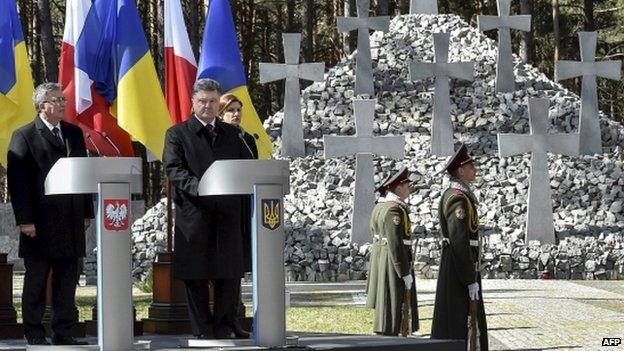 Ukraine's President Petro Poroshenko (2nd from left) visit the National Historic and Memorial Reserve 'Bykivnia Graves', commemorating victims of Soviet-era repressions, near Kiev 9 April 2015.