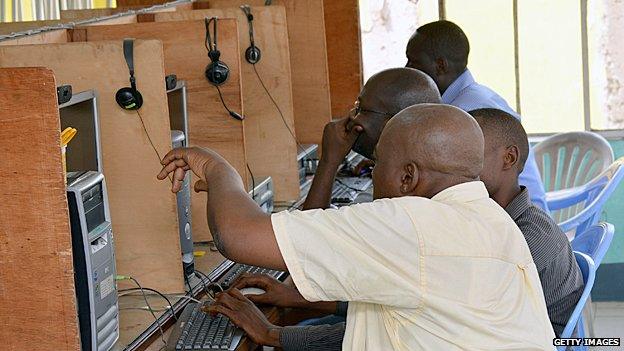 Men in an internet cafe in Kinshasa