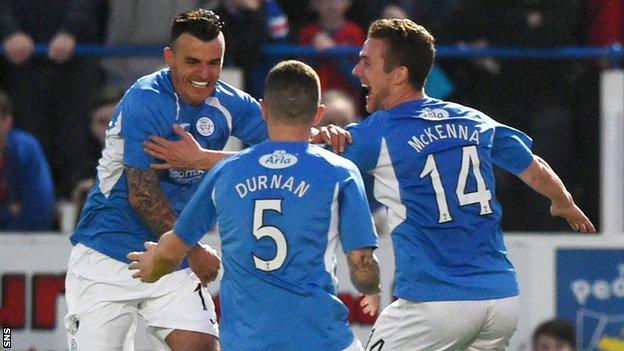 Derek Lyle (left) celebrates scoring for Queen of the South