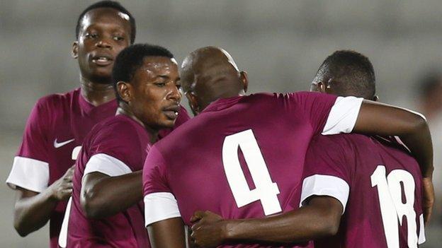 Qatar celebrate against Slovenia