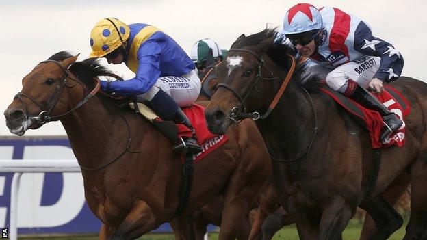 Outback Traveller ridden by Ryan Moore (left) in action at Kempton on Sunday