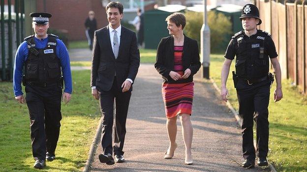 Labour leader Ed Miliband and Shadow Home Secretary Yvette Cooper, with officers from Ollerton Police Station, Nottinghamshire