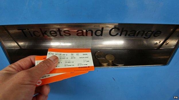 Man buying a rail ticket