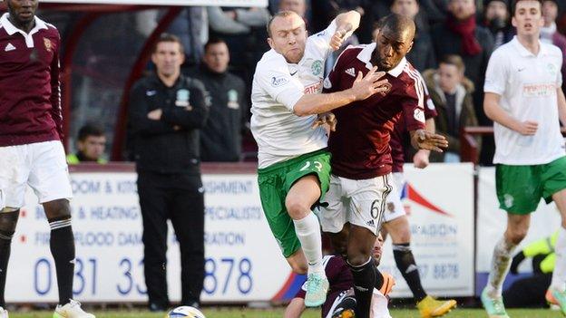 Hibernian's Dylan McGeouch (left) battles with Morgaro Gomis