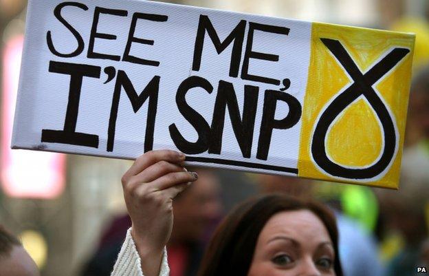 An activist holds a pro-SNP sign in Stirling