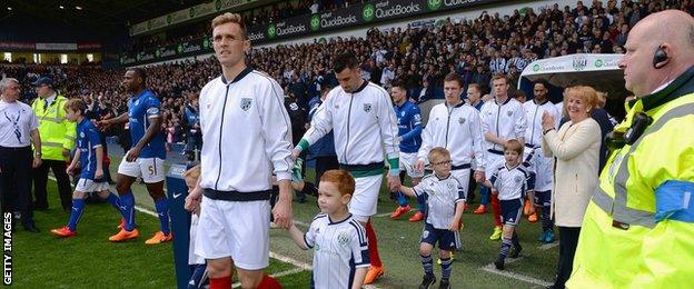 Darren Fletcher leads out West Brom against Leicester