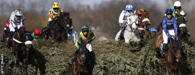 Leighton Aspell leads the Grand National aboard Many Clouds