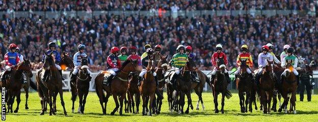 Riders await the start of the Grand National