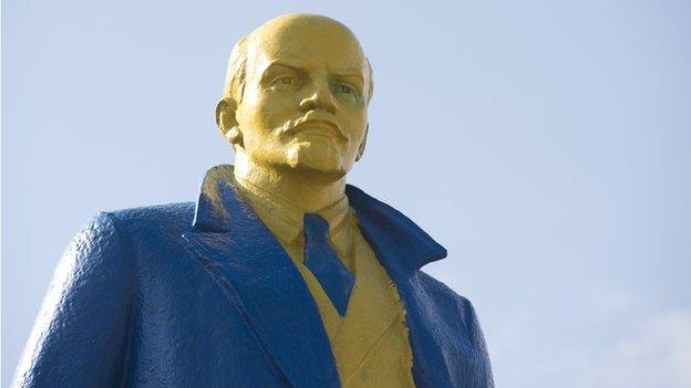 Statue of Lenin painted in the colours of the Ukrainian flag