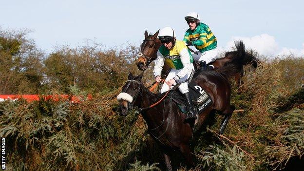 AP McCoy aboard Shutthefrontdoor pursues eventual winner Many Clouds