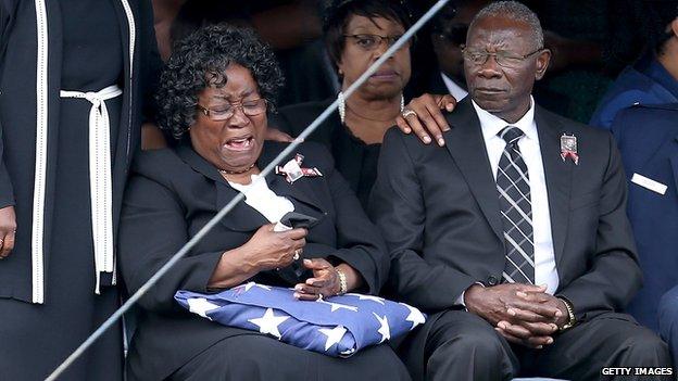 Judy Scott is overcome with emotion during the burial service on 11 April 2015