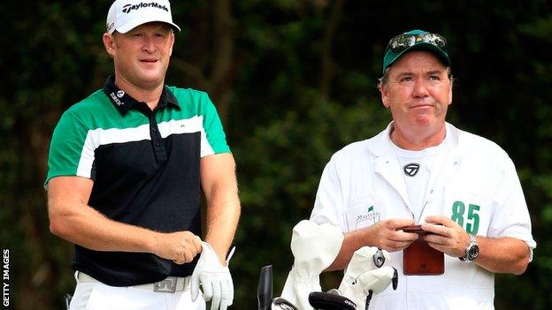 Jamie Donaldson of Wales waits on the second tee alongside caddie Michael Donaghy during the third round